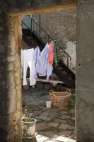 Washing on line in country courtyard 