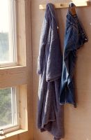 Clothes on wall mounted hooks 
