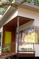 Modern house exterior with large door numbers