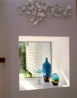 Decorative glassware on windowsill 