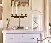Clock and candelabra on chest of drawers 