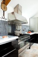 Modern kitchen with stainless steel range