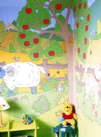Colourful mural on childs bedroom wall 
