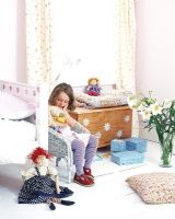 Little girl in classic bedroom 