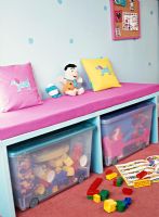 Seat over storage boxes in colourful room 