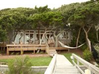 Wooden walkway to modern house 