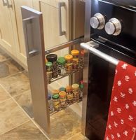 Detail of spice rack drawer in modern kitchen 