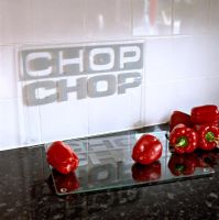 Red peppers on modern kitchen worktop 