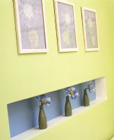 Modern alcove shelf with vases of flowers 