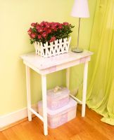 Modern side table with flowering plant
