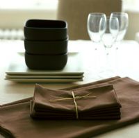 Detail of serviettes on modern dining table 