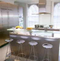 Modern kitchen with glass breakfast bar