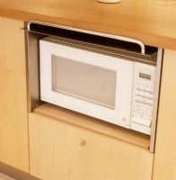 Microwave in kitchen cupboard 