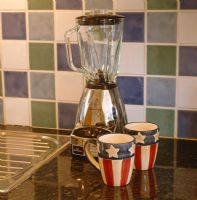 Blender and mugs on kitchen worktop 