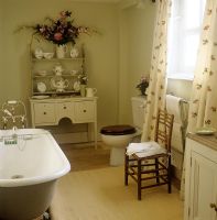 Country bathroom with display of crockery 