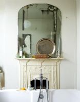 Fireplace in classic bathroom 