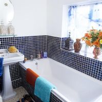 Modern bathroom with navy blue mosaic tiles 