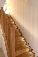 Modern staircase with wall lighting 