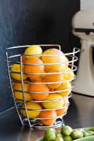 Metal fruit bowl on kitchen worktop 