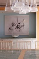 Modern painting on dining room wall 