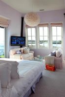 Television and seating in modern bedroom 