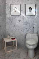 Toilet in modern marble bathroom 