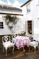 Garden table and chairs on country terrace 