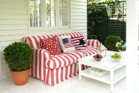 Colourful striped sofa on terrace 