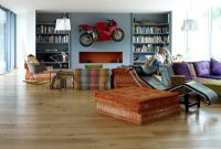 Contemporary living room with motorbike on wall