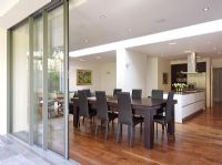 View through patio doors to modern dining room 
