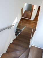 View down contemporary wooden staircase 