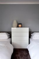 Chest of drawers in twin bedroom 