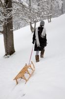 Woman pulling sledge