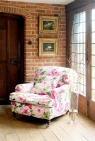 Floral armchair in country living room 