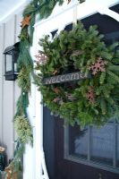 Christmas wreath decorating country front door