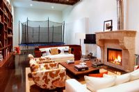 Fireplace in modern living room with trampoline