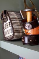Detail of leather cuffs and bag 