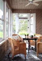 Wicker furniture in country conservatory 