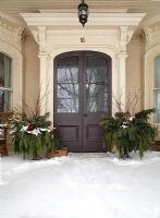 Exterior of classic front door in snow 