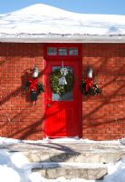 Exterior of front door decorated for Christmas 