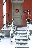 Carved toy soldier on Classic front porch 