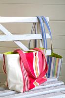 Striped bags on vintage bench 