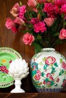 Flower arrangement in vintage floral vase 