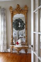 Gilded mirror in classic bedroom