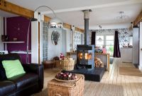 Open plan living room with wood burning stove 