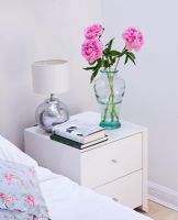 Flowers on modern bedside table 
