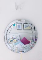 Circular mirror in modern bedroom 