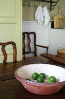 Rustic bowl with limes