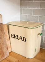 Vintage bread bin on kitchen worktop 