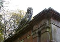 Lion statue on classic house exterior 